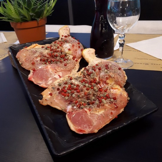 Cosce di pollo condite